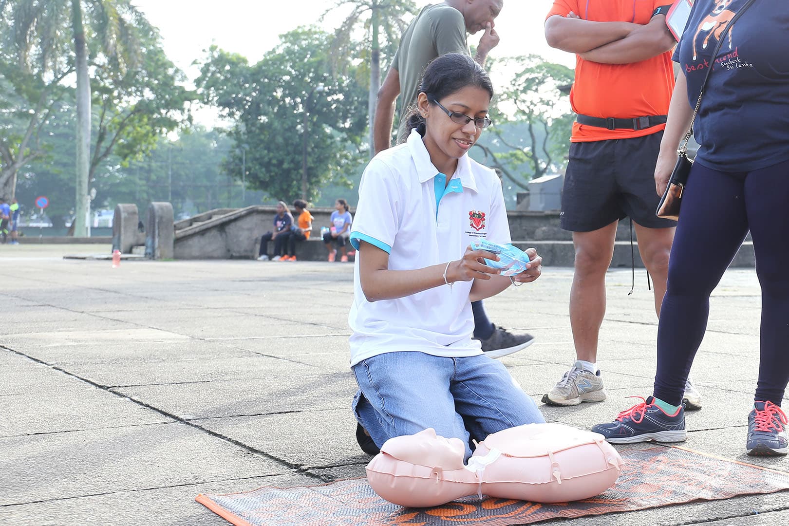 A participant practising CPR with a training manikin at a Restart a Heart event in Sri Lanka